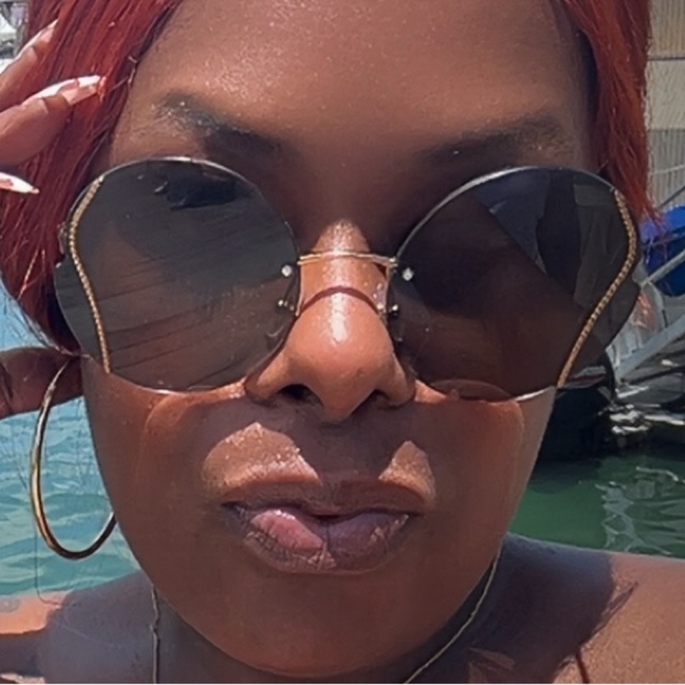 Miu Miu Round Sunglasses with Gold Accents